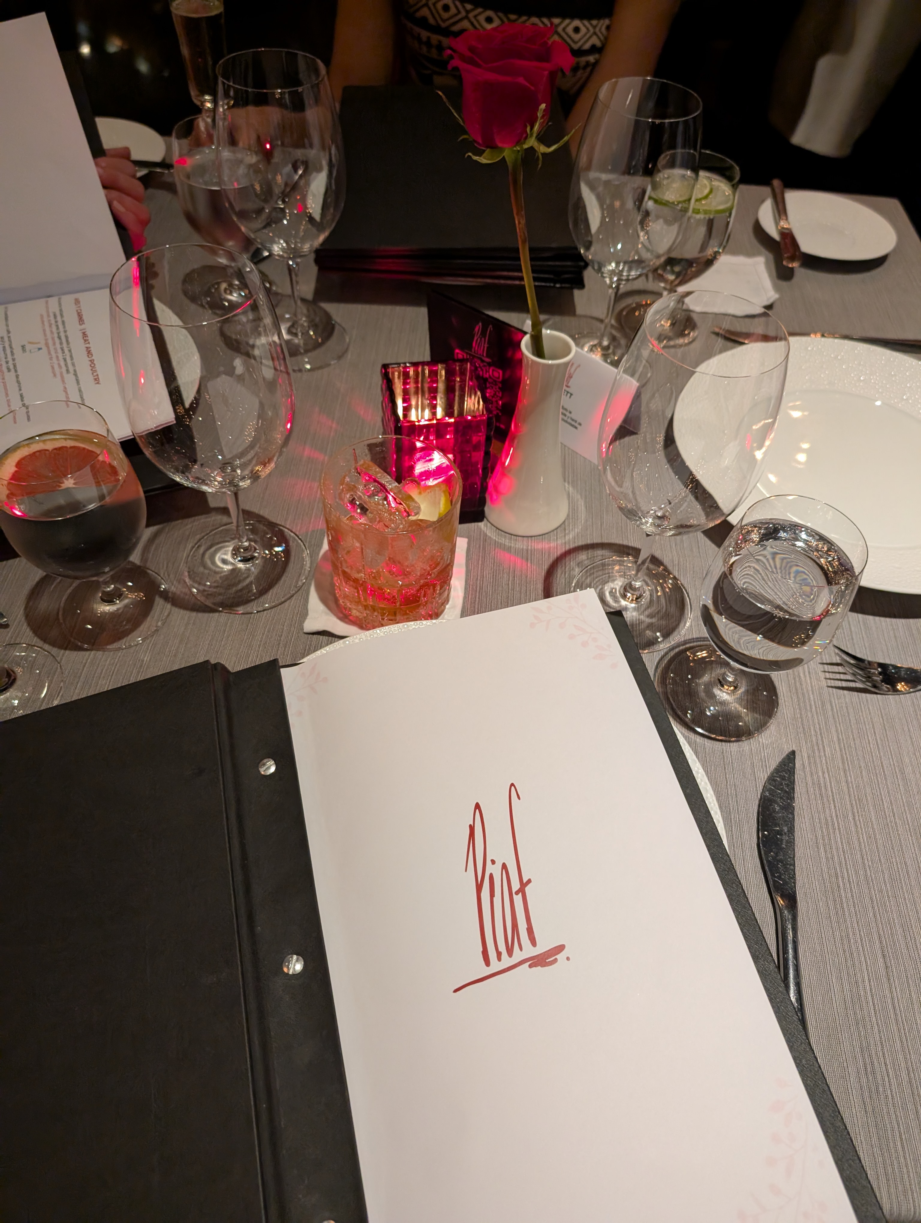 Gourmet dinner at Piaf restaurant Grand Velas - five-diamond table setting and menu