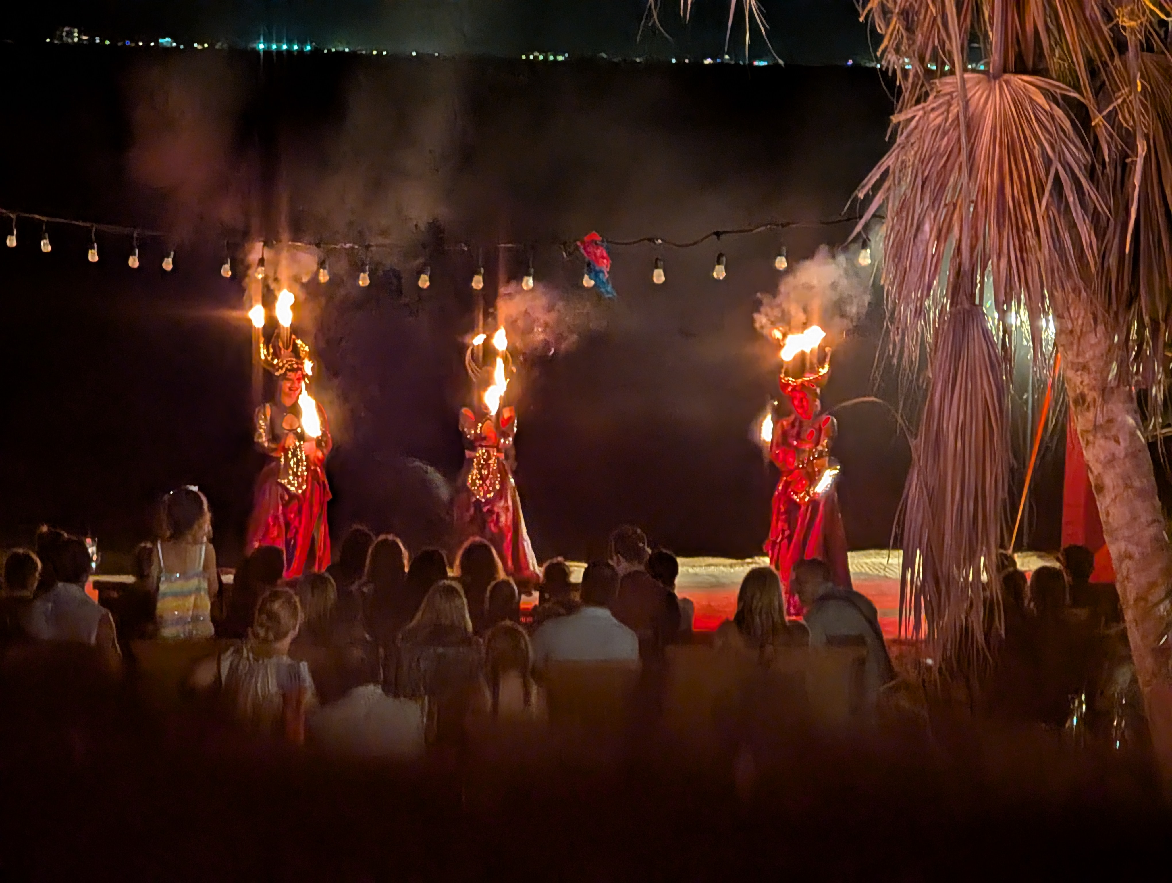 Fire dancers performing on the beach at Grand Velas Riviera Maya on New Year's Eve